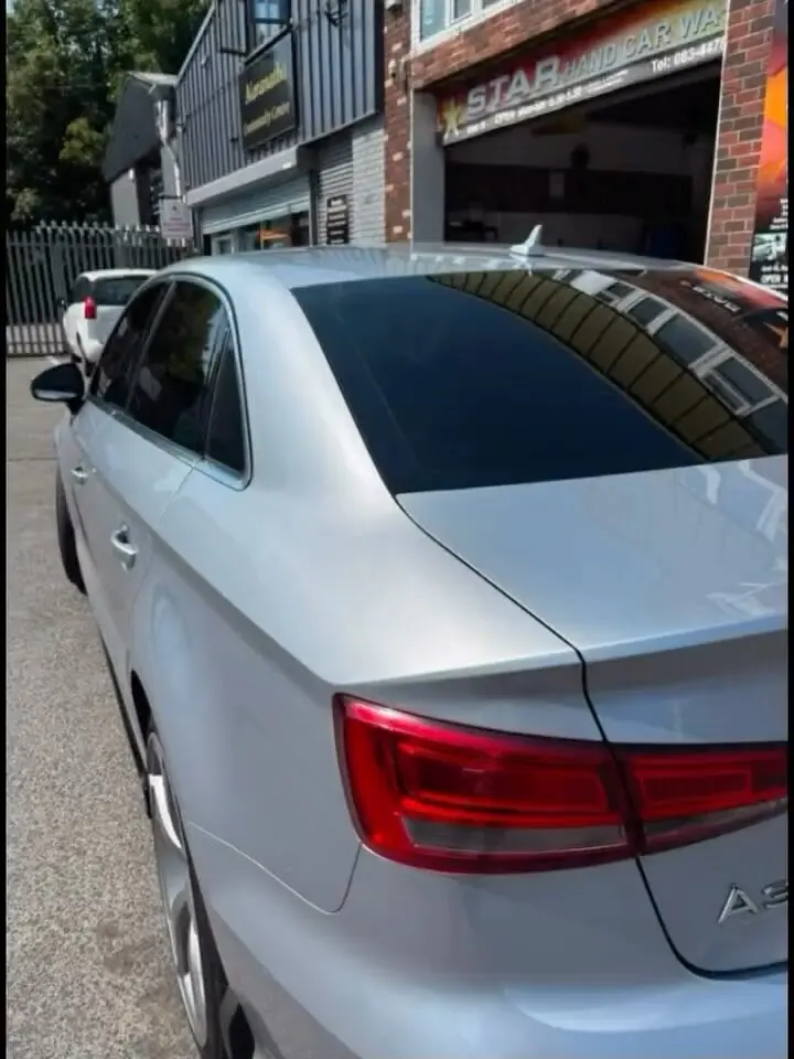 Silver Audi with professionally tinted rear windows